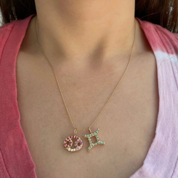 zodiac-charm-pendant-necklaces Wearing two Zodiac charm pendants