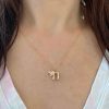 gold-chai-charm-chai-symbol-charm-elisa-solomon-jewelry wearing the 14k yellow gold chai symbol charm necklace