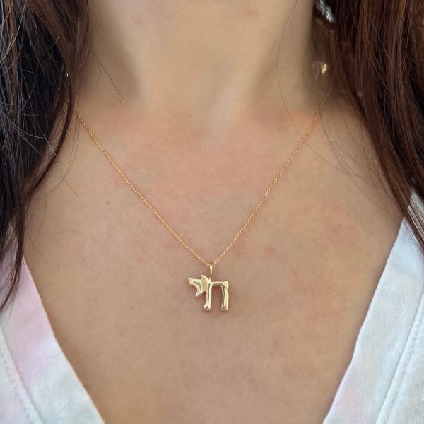 gold-chai-charm-chai-symbol-charm-elisa-solomon-jewelry wearing the 14k yellow gold chai symbol charm necklace