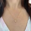 wearing the custom paw charm necklace in 14k yellow gold with citrines