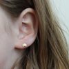 wearing the bear stud earrings