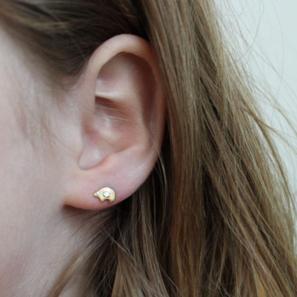 wearing the bear stud earrings