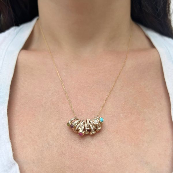 multiple-rings-necklace wearing many teeny ring necklaces on one chain