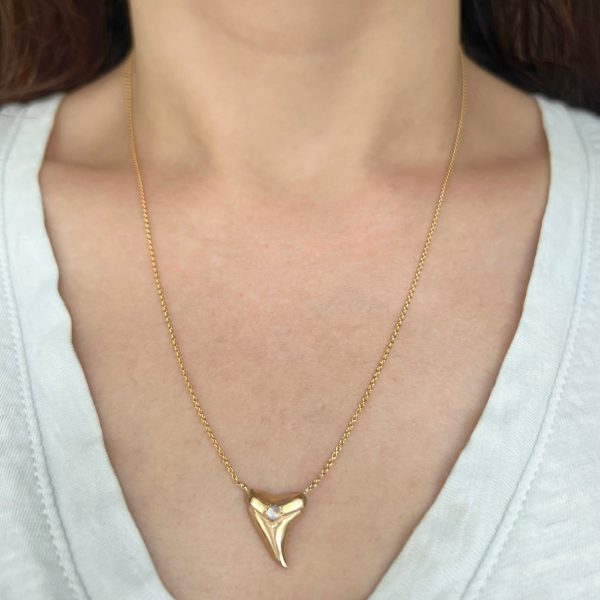 shark-tooth-necklace-gold-diamonds Wearing the 14k yellow gold Custom Shark Tooth Necklace