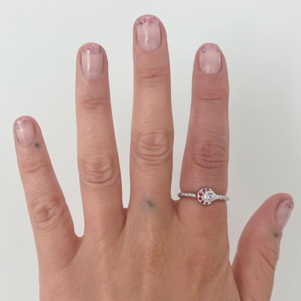 sun-moon-ring-gemstones wearing the gold moon and sun ring with gemsotnes