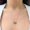 tiny-rings-necklace- wearing 3 teeny ring necklaces on one chain