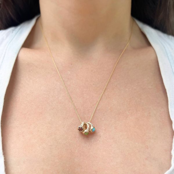 tiny-rings-necklace- wearing 3 teeny ring necklaces on one chain