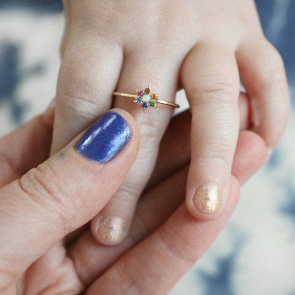 infant hand wearing the elisa solomon star ring