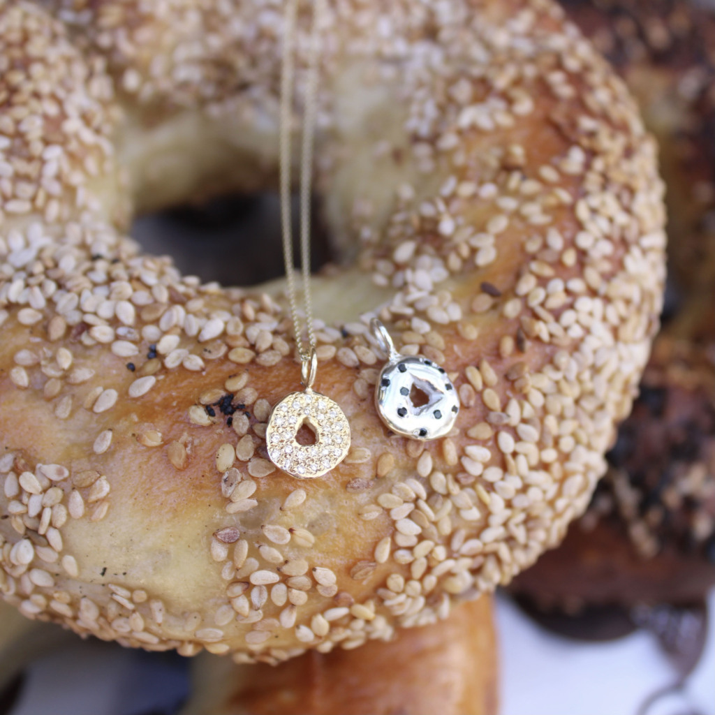 bagel charm necklace in 14k gold with diamond seeds and cream cheese