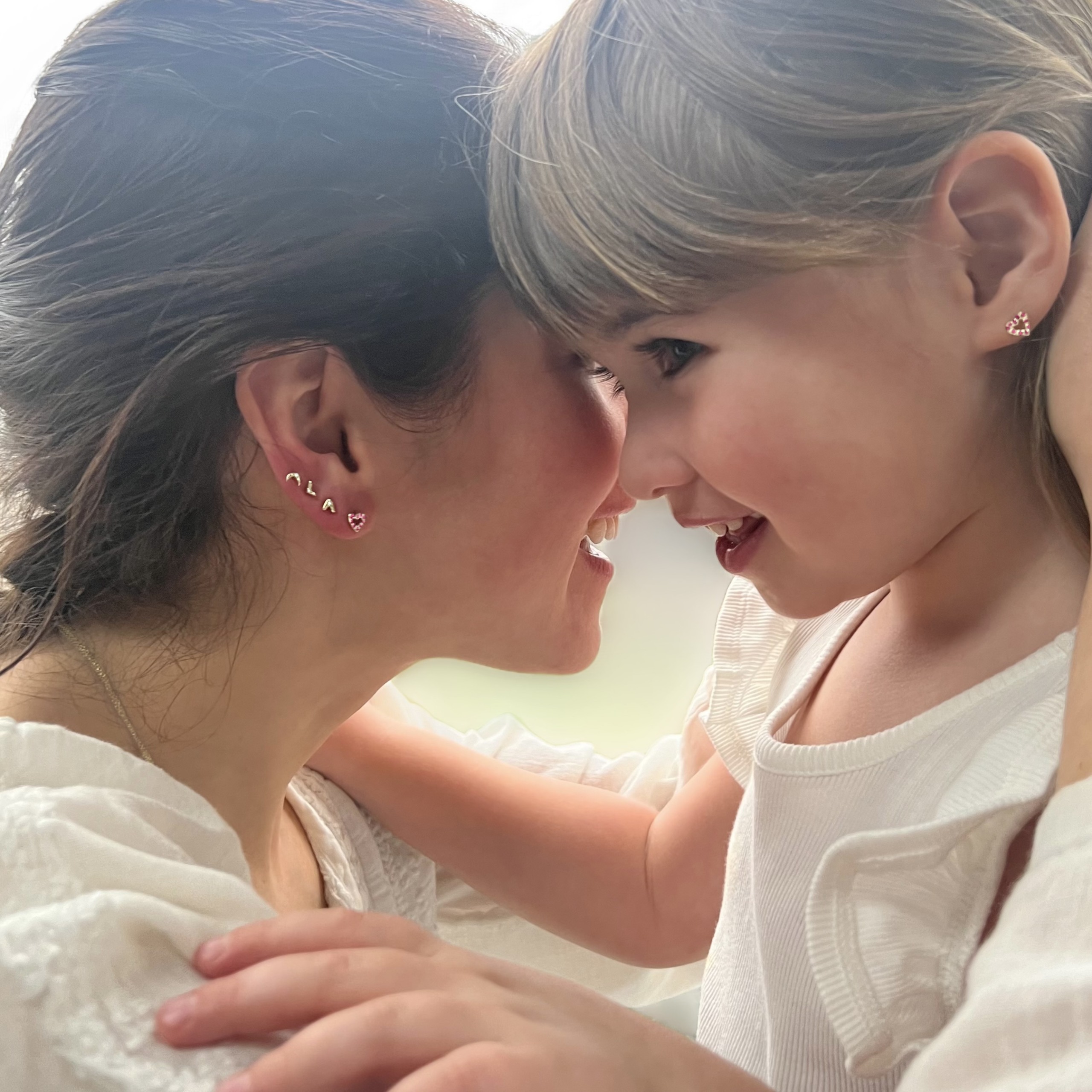Wearing the Custom Tiny Open Heart Studs celebrating Mother's day