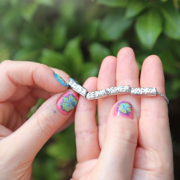 holding-the-tiny-gold-diamond-name-beads-2 holding the the tiny gold diamond name bead bracelets
