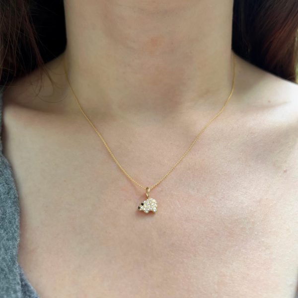 wearing-the-gold-polar-bear-diamond-charm-necklace wearing the gold polar bear diamond charm