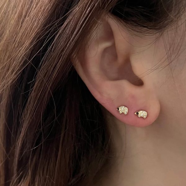 wearing-the-tiny-gold-polar-bear-diamond-stud-earrings wearing the tiny gold polar bear diamond stud earrings