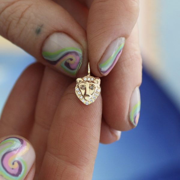 close-up-holding-the-lion-charm-2 Holding the Lion Charm close-up