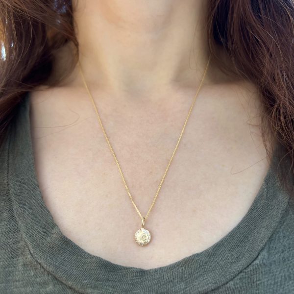 the-engraved-diamond-circle-charm-worn-around-elisas-neck wearing the diamond circle charm