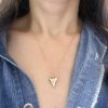 wearing the custom engraved shark tooth necklace