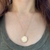 wearing the large circle charm