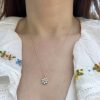 wearing the 14k gold birthstone flower charm set with