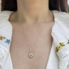 wearing the 14k gold birthstone flower charm set with