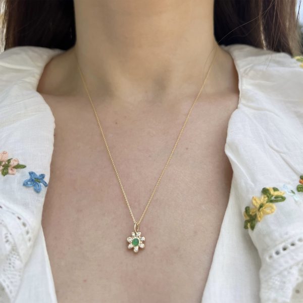 wearing the 14k gold birthstone flower charm set with