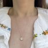 wearing the birthstone flower charm