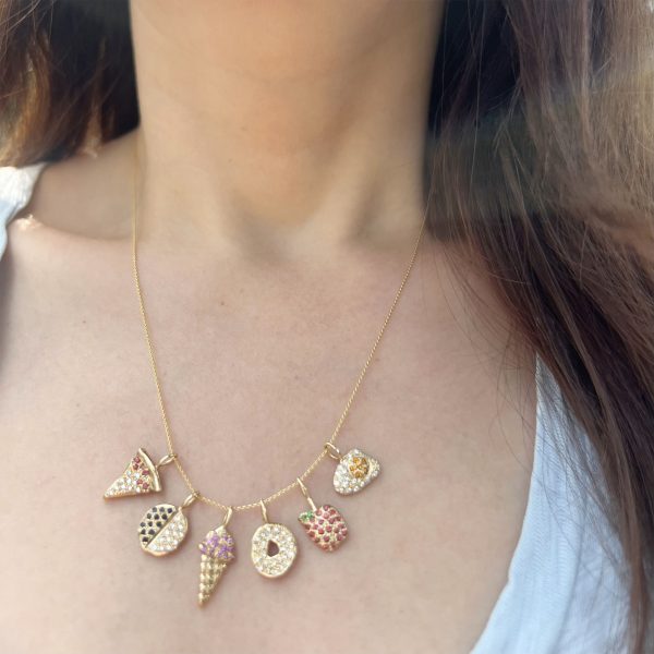 wearing the collection of 14k gold food charms