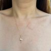 wearing the 14k yellow gold lighting bolt charm necklace