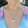 unicorn-charm wearing the 14k gold unicorn charm with diamonds and a blue sapphire eye