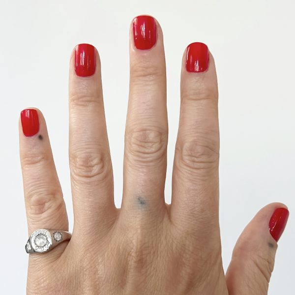 wearing the large rosecut diamond engraved signet ring handcrafted by Elisa Solomon